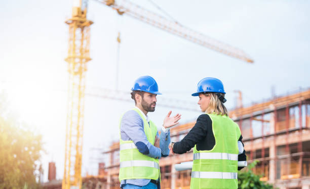 istock Two mid adult engineers on a construction site. 1089868388