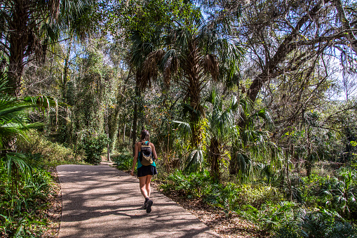 Woman on a trail near Rainbow Springs, Florida. Gulf Coast States.