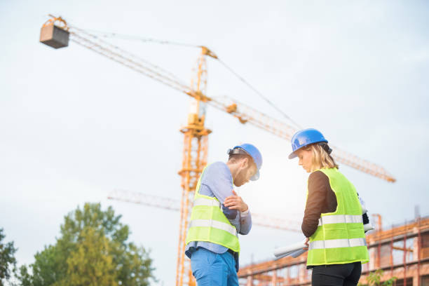 istock Two mid adult engineers on a construction site. 1089868670