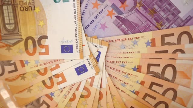 VIDEO, extremely close-up of euro banknotes, rotational slow motion