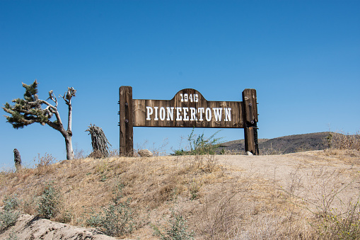 Pioneertown, California - July 1, 2018: Sign for Pioneertown, a community founded by Hollywood investors to make Western movies, is located in the Morongo Basin region of California.