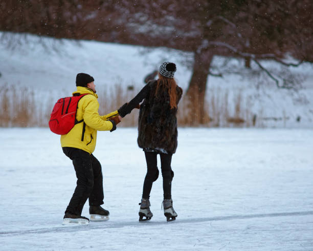 istock Guy learning his girl Ice skating 1089898028