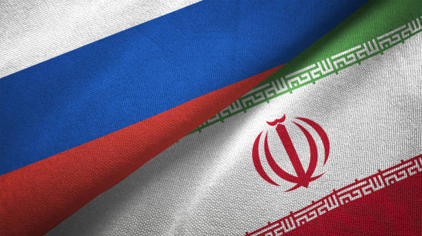 iran e russia due bandiere insieme realizzano tessuto tessuto texture - russia foto e immagini stock