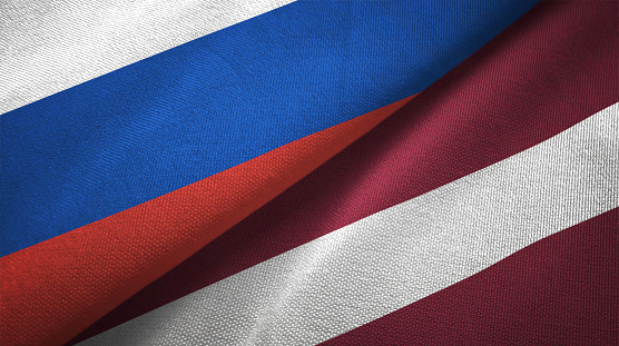 Latvia and Russia flag together realtions textile cloth fabric texture