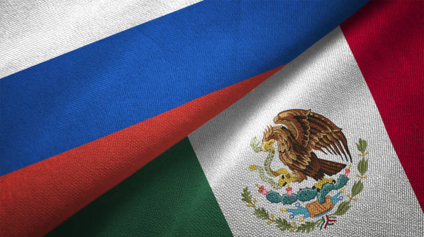 istock Mexico and Russia two flags together realations textile cloth fabric texture 1089910664