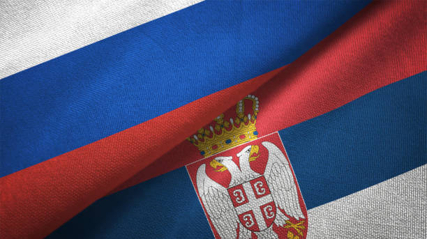 serbia and russia two flags together realations textile cloth fabric texture - bandeira da sérvia imagens e fotografias de stock