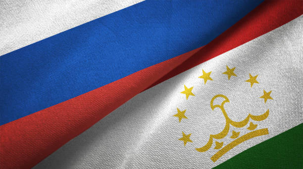 tajikistan and russia two flags together realations textile cloth fabric texture - tajik flag imagens e fotografias de stock