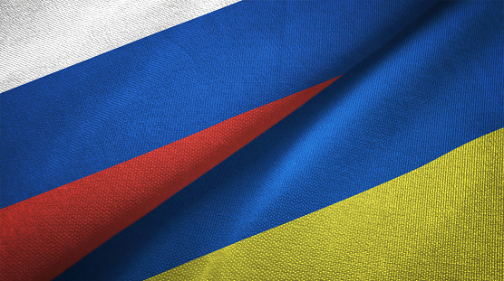 Ucrania y Rusia dos banderas juntos relaciones textil tela textura de la tela photo