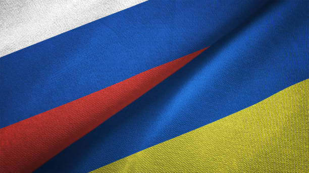 Ukraine and Russia two flags together realations textile cloth fabric texture Ukraine and Russia flag together realtions textile cloth fabric texture russian flag stock pictures, royalty-free photos & images