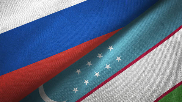 istock Uzbekistan and Russia two flags together realations textile cloth fabric texture 1089911584