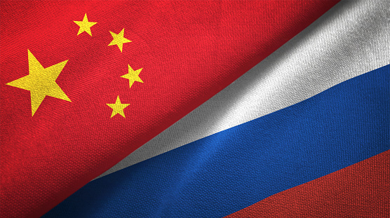 Rusia y China dos banderas juntos relaciones textil tela textura de la tela photo