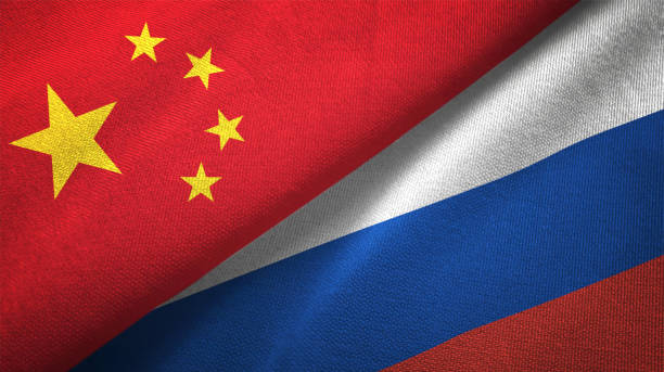 russia and china two flags together realations textile cloth fabric texture - chinês imagens e fotografias de stock