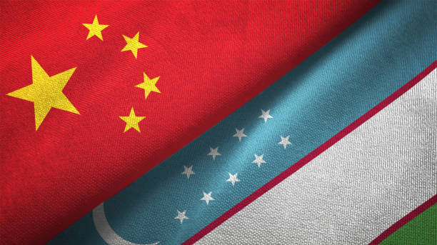 istock Uzbekistan and China two flags together realations textile cloth fabric texture 1089915322