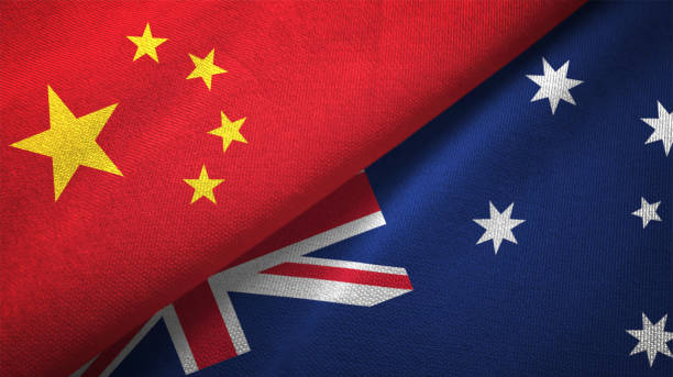 australia e cina due bandiere insieme realizzano tessuto tessuto texture - australian flag foto e immagini stock