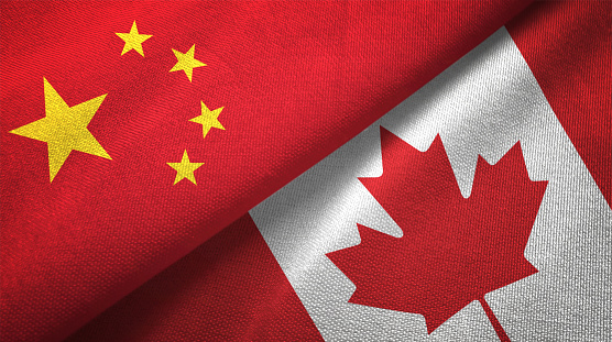 Canadá y China dos banderas juntos relaciones textil tela textura de la tela photo