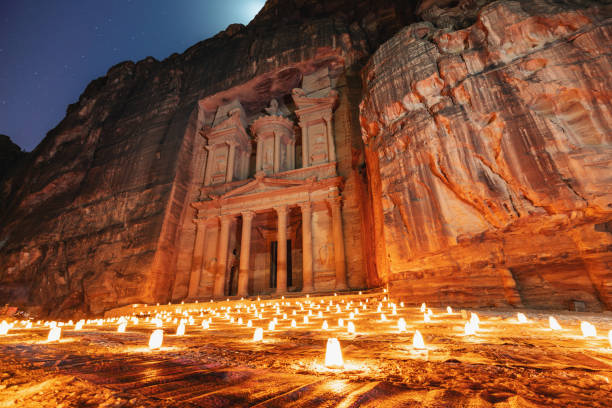 Petra by night, Treasury ancient architecture in canyon, Petra in Jordan. 7 wonders travel destination in Jordan stock photo