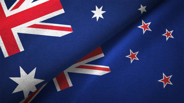 New Zealand and Australia two flags together realations textile cloth fabric texture New Zealand and Australia flag together realtions textile cloth fabric texture diplomacy photos stock pictures, royalty-free photos & images