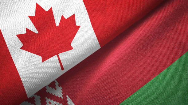 istock Belarus and Canada two flags together realations textile cloth fabric texture 1089929956