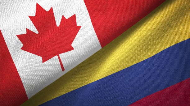 istock Colombia and Canada two flags together realations textile cloth fabric texture 1089929992