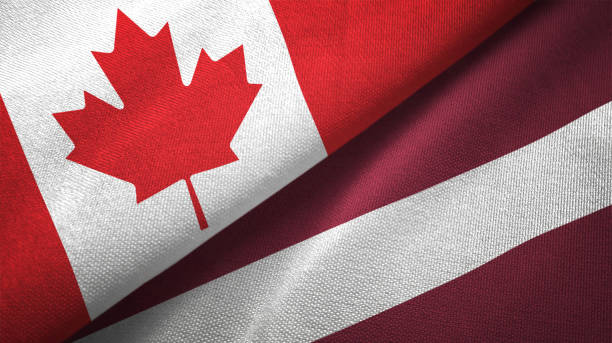 istock Latvia and Canada two flags together realations textile cloth fabric texture 1089930444