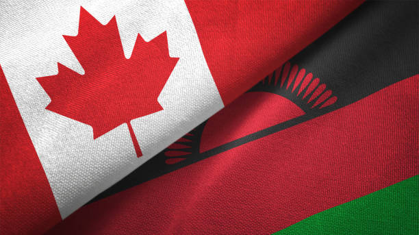 istock Malawi and Canada two flags together realations textile cloth fabric texture 1089930522