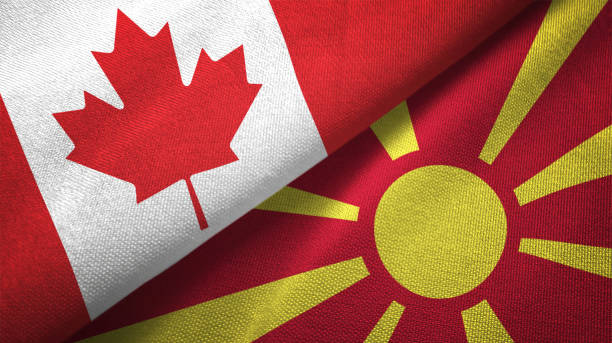 istock Macedonia and Canada two flags together realations textile cloth fabric texture 1089930528