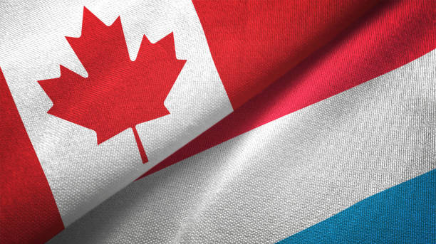 istock Luxembourg and Canada two flags together realations textile cloth fabric texture 1089930538