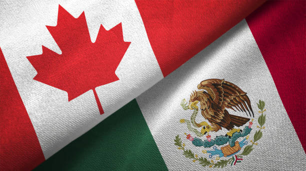istock Mexico and Canada two flags together realations textile cloth fabric texture 1089930618