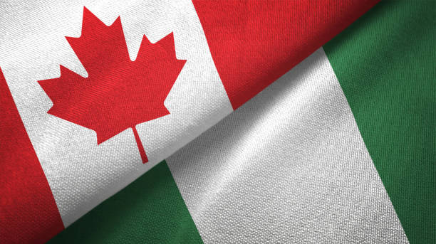 istock Nigeria and Canada two flags together realations textile cloth fabric texture 1089930694
