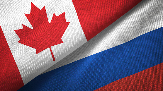 Rusia y Canadá dos banderas juntos relaciones textil tela textura de la tela photo