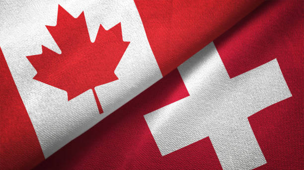 istock Switzerland and Canada two flags together realations textile cloth fabric texture 1089930950