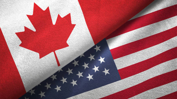 United States and Canada two flags together realations textile cloth fabric texture United States and Canada flag together realtions textile cloth fabric texture canada stock pictures, royalty-free photos & images