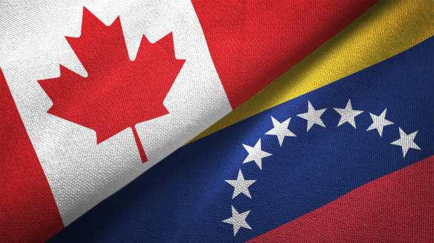 istock Venezuela and Canada two flags together realations textile cloth fabric texture 1089931114