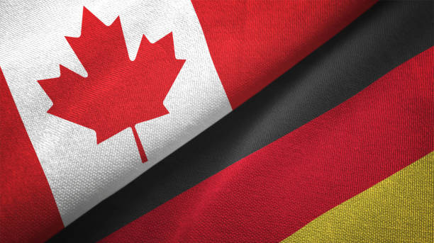 istock Germany and Canada two flags together realations textile cloth fabric texture 1089931118