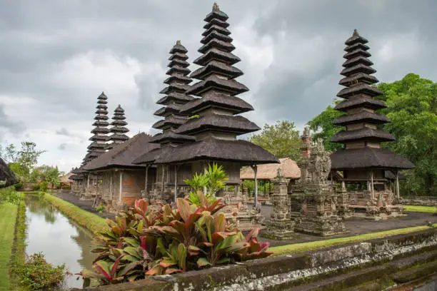 Photo of Scenery view of spiritual shrine inner temple of Pura Taman Ayun the royal temple of Mengwi empire in Badung Regency, Bali, Indonesia. View in the Cloudy day.