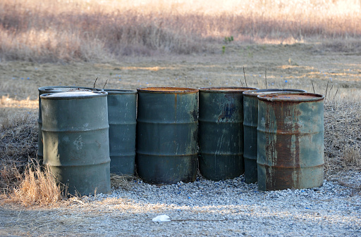 Discarded oil drum cans