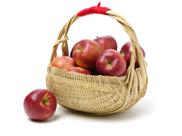 istock Apple food in a basket over white background 1089940230