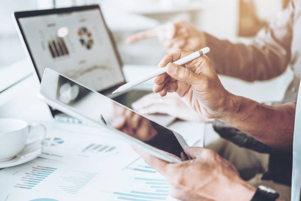 istock Co-working Business Team meeting Planning Strategy Analysis investment and saving concept. meeting discussing new plan financial graph data on Laptop. 1089940512