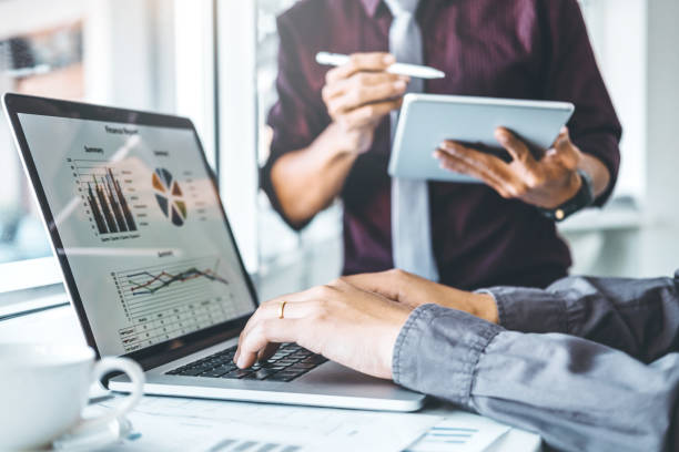 istock Co-working Business Team meeting Planning Strategy Analysis investment and saving concept. meeting discussing new plan financial graph data on Laptop. 1089940514