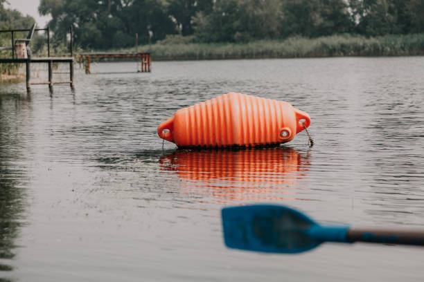istock large orange buoy lies on water 1089954516