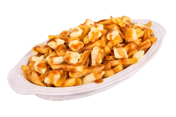 istock Poutine plate isolated on white background. Canadian cuisine. 1089959808