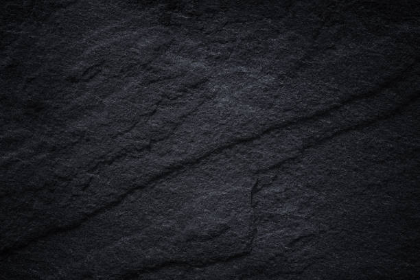 istock Dark grey black slate background or natural stone texture. 1089962756