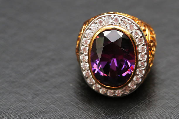 istock Purple gem stone on gold ring with diamond 1089963246