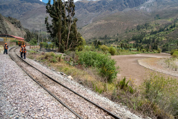 Cusco, Peru - October 17, 2018 : Railway workers are maintaining the Inca Railway.