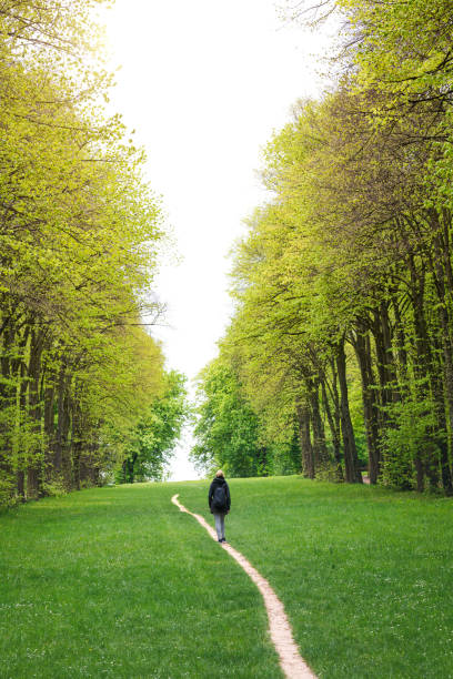istock Walking In City Park 1089976572