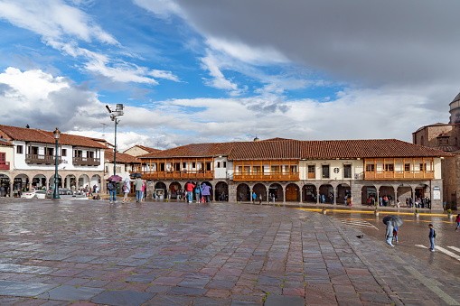 Cusco, Peru - October 14, 2018: Plaza de Armas, the town center of the city of Cusco, Peru. Tourists walking around the busy square.