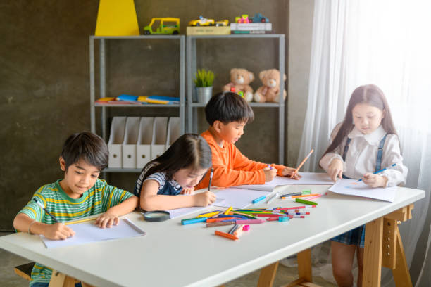 asian kid in creative art workshop a scuola. - sleeping high school desk education foto e immagini stock