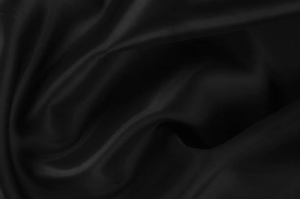 istock Soft focus cloth silk black. Take home this black washed silk! The washed black color is a soft, silky hand. Thin and light, it has a liquid drape that stands out when creating soft silhouettes. 1089980106