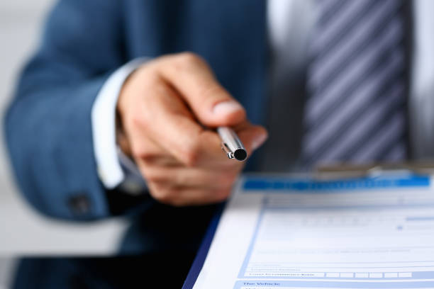 istock Male insurance agent hand draws a silver pen 1089994826