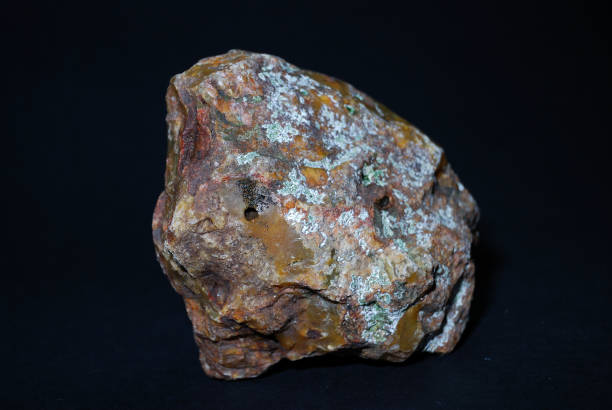 istock Jasper natural rough stone on a black background 1090004236